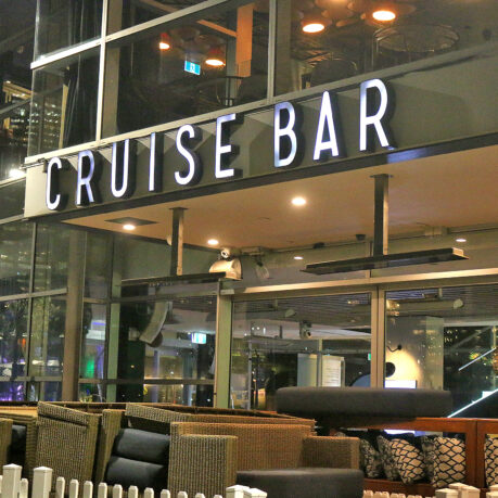 a cruise bar with a sign
