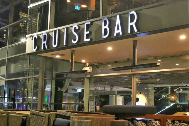 a cruise bar with a sign