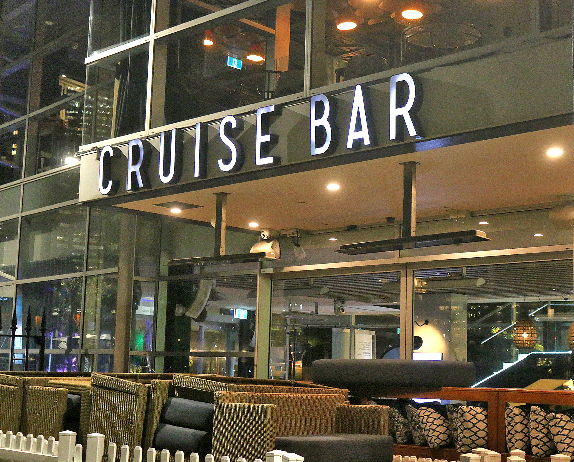 a cruise bar with a sign