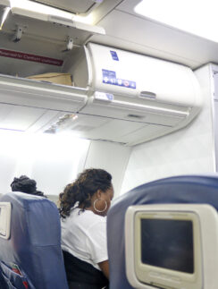 a woman sitting in a plane