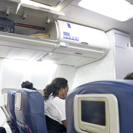 a woman sitting in a plane