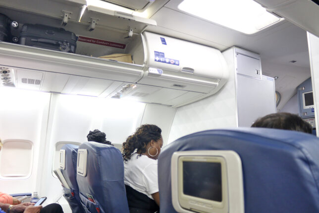 a woman sitting in a plane