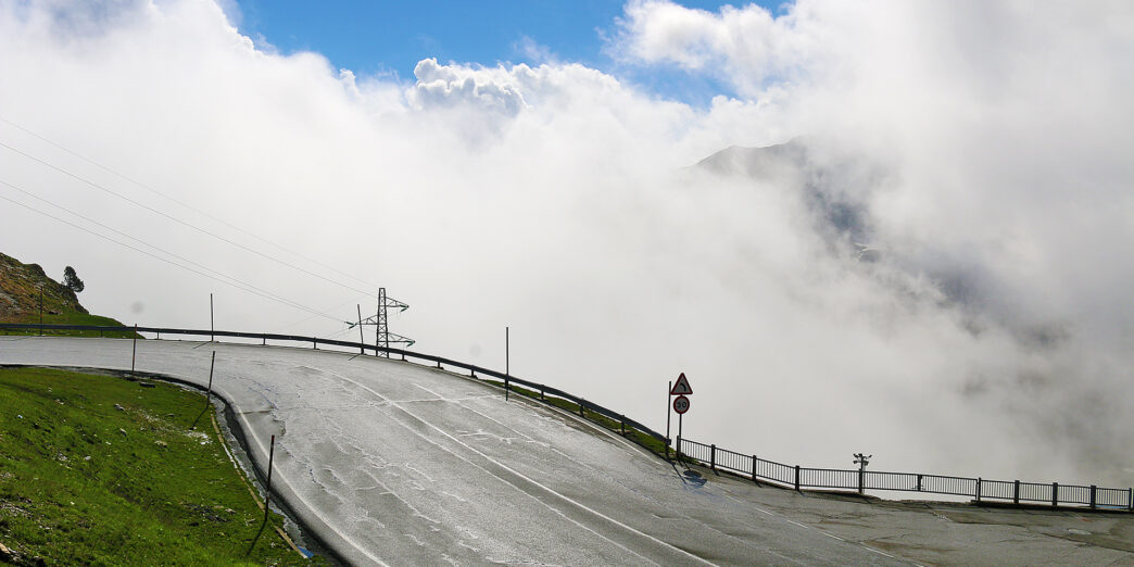 a road with clouds in the sky