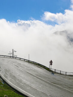a road with clouds in the sky