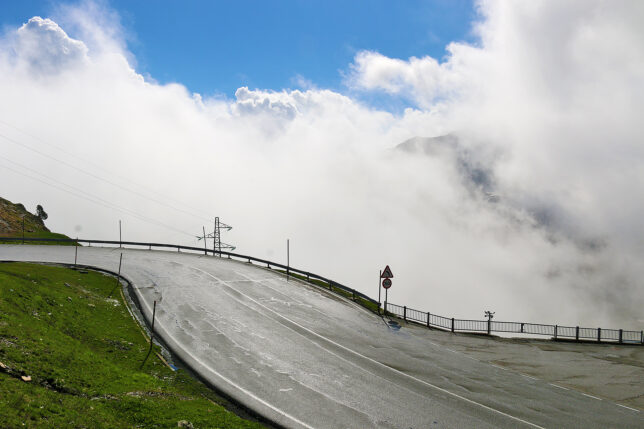 a road with clouds in the sky