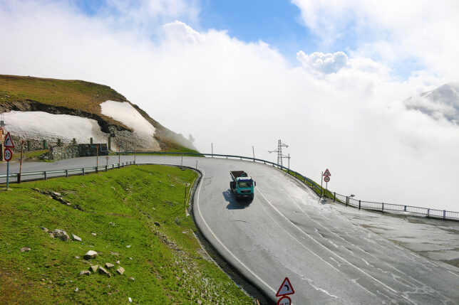 a truck driving on a road