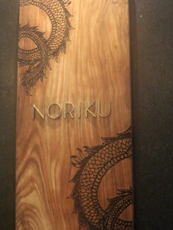 a wood box with a dragon design