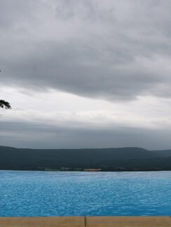 a pool with a view of the mountains