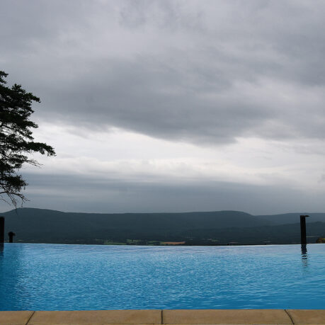 a pool with a view of the mountains