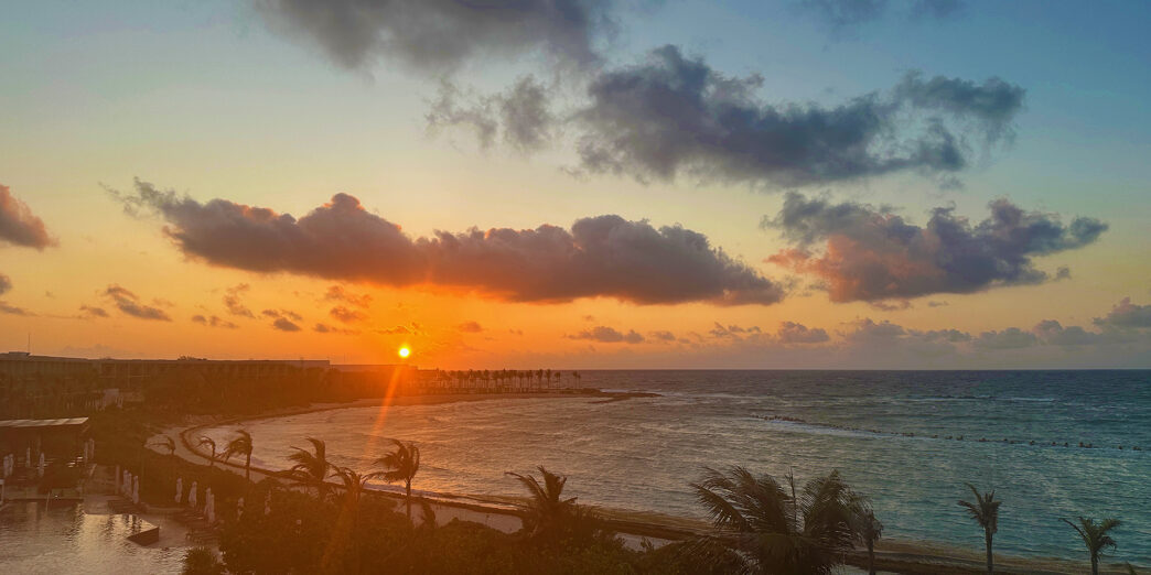 a sunset over a body of water