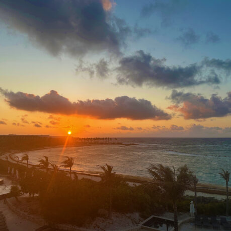 a sunset over a body of water
