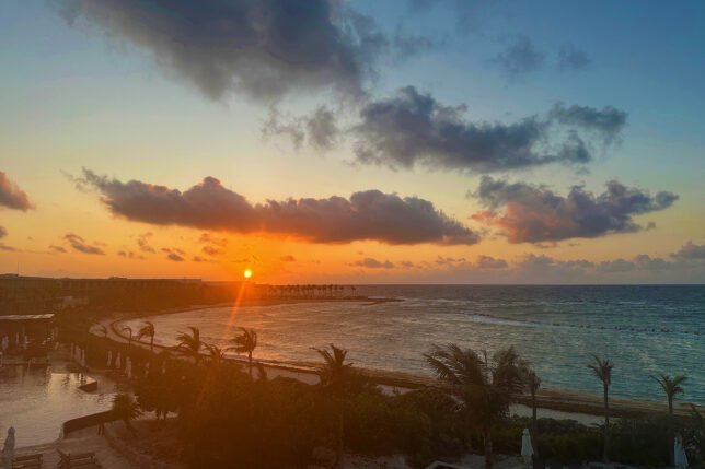 a sunset over a body of water