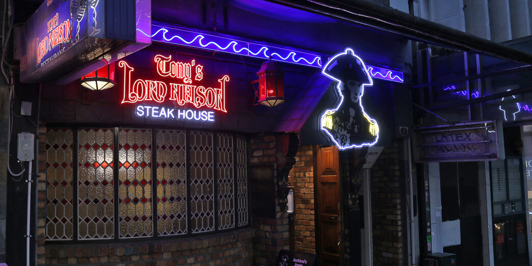 a building with neon signs