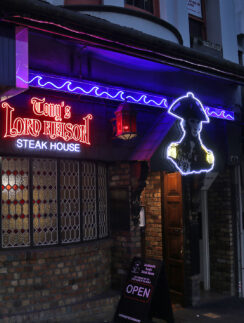 a building with neon signs