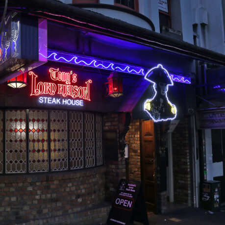 a building with neon signs