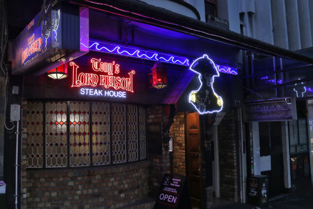 a building with neon signs