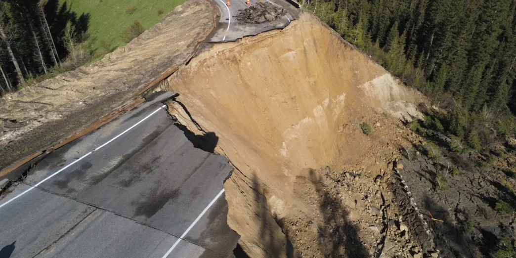 a road that has been eroded by a cliff