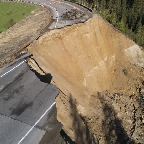 a road that has been eroded by a cliff