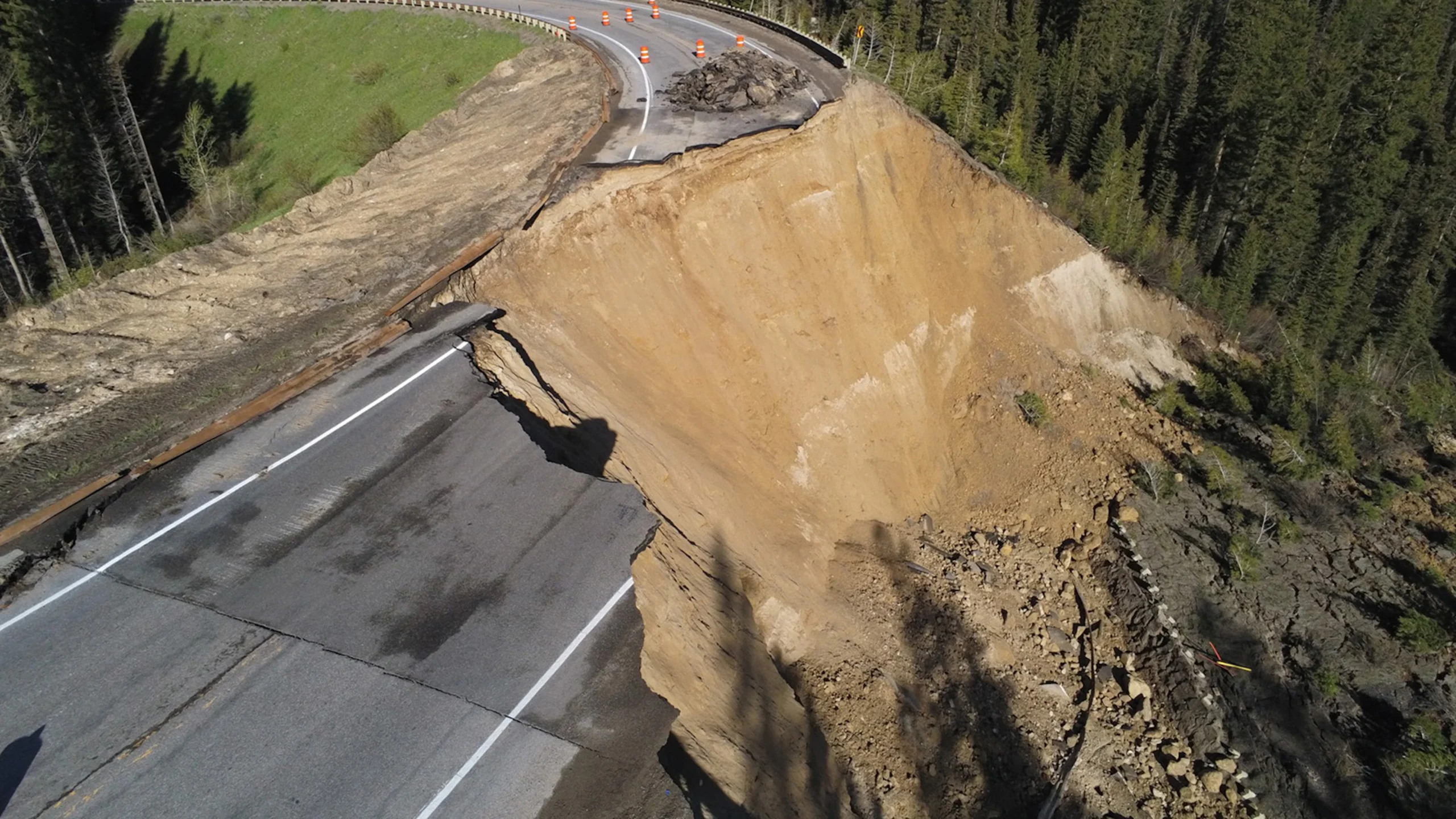 a road that has been eroded by a cliff