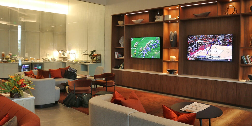 a room with a tv and couches