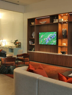 a room with a tv and couches