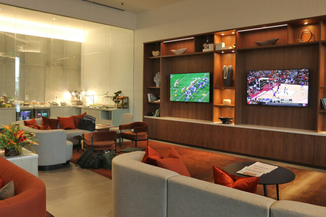 a room with a tv and couches