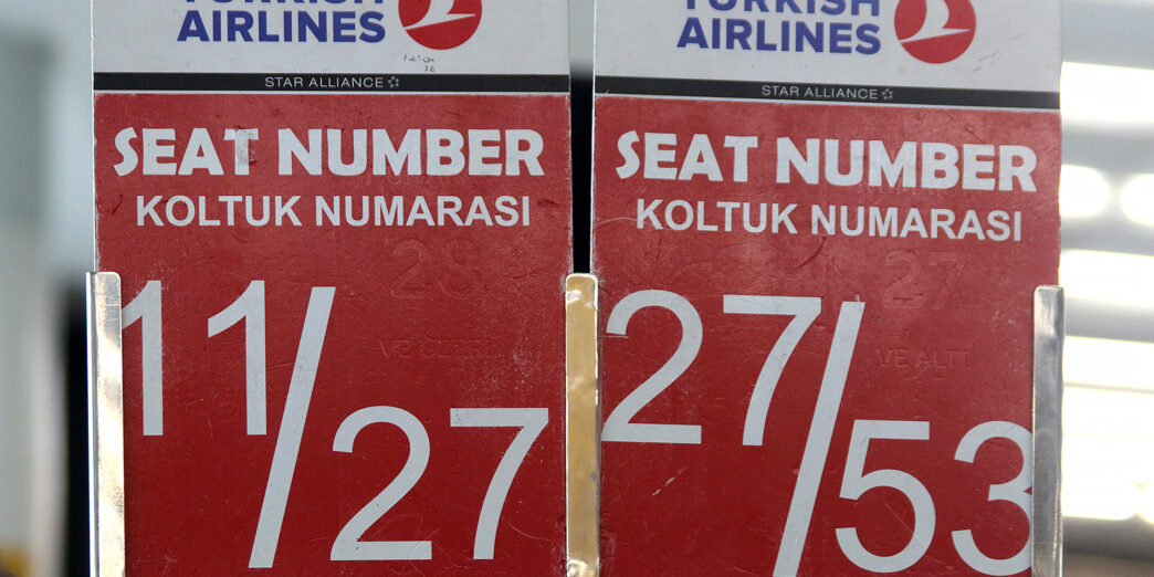 a red and white sign with white text