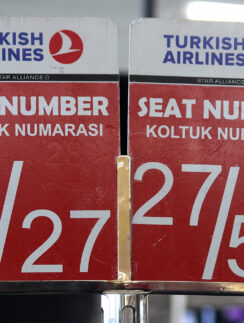 a red and white sign with white text