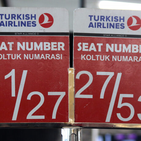 a red and white sign with white text