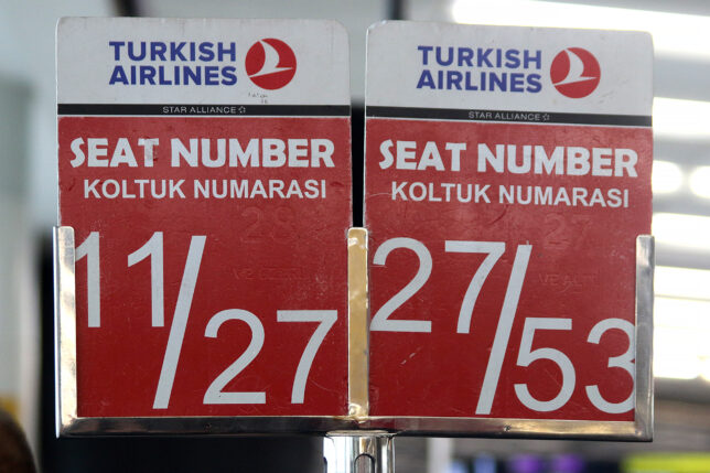 a red and white sign with white text