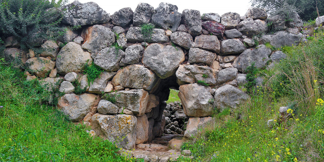 a stone wall with a doorway