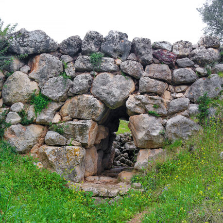 a stone wall with a doorway