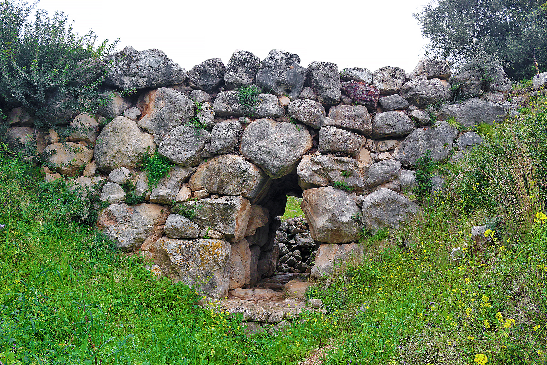 a stone wall with a doorway