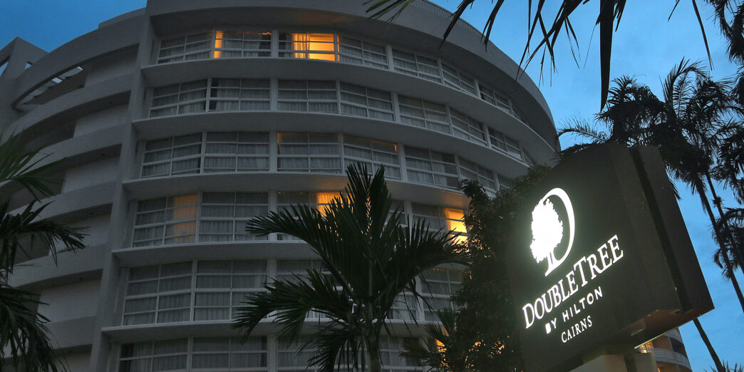 a building with palm trees