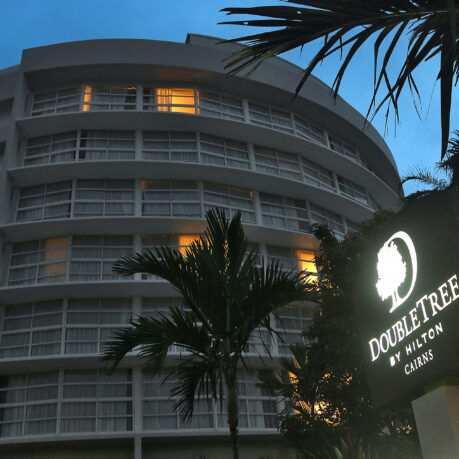 a building with palm trees