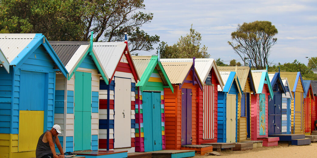 a row of colorful beach huts