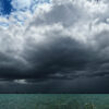 a large dark clouds over water