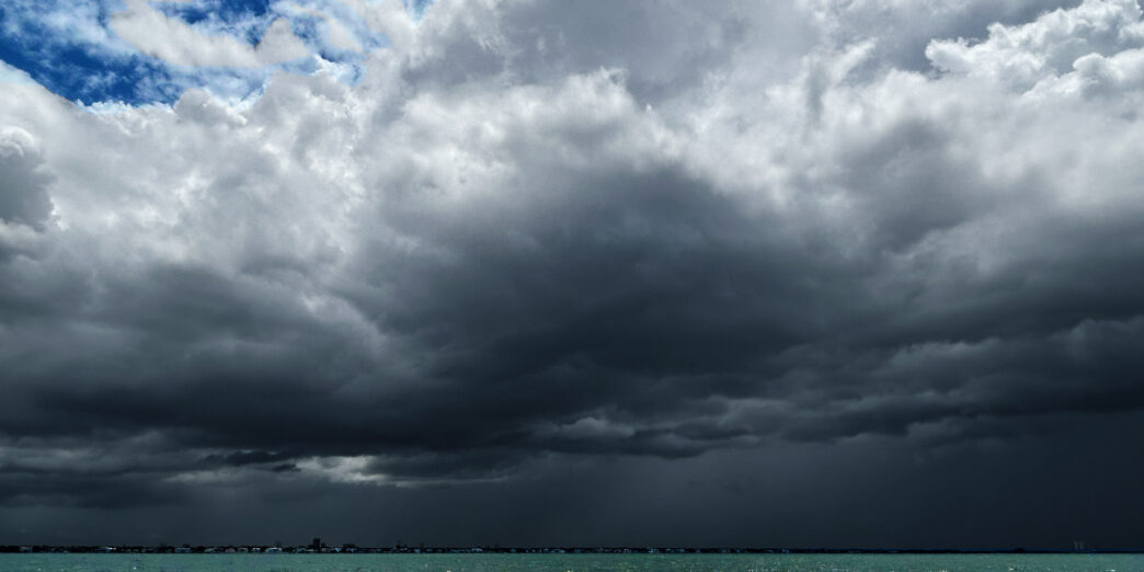 a large dark clouds over water