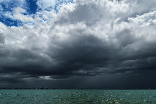 a large dark clouds over water