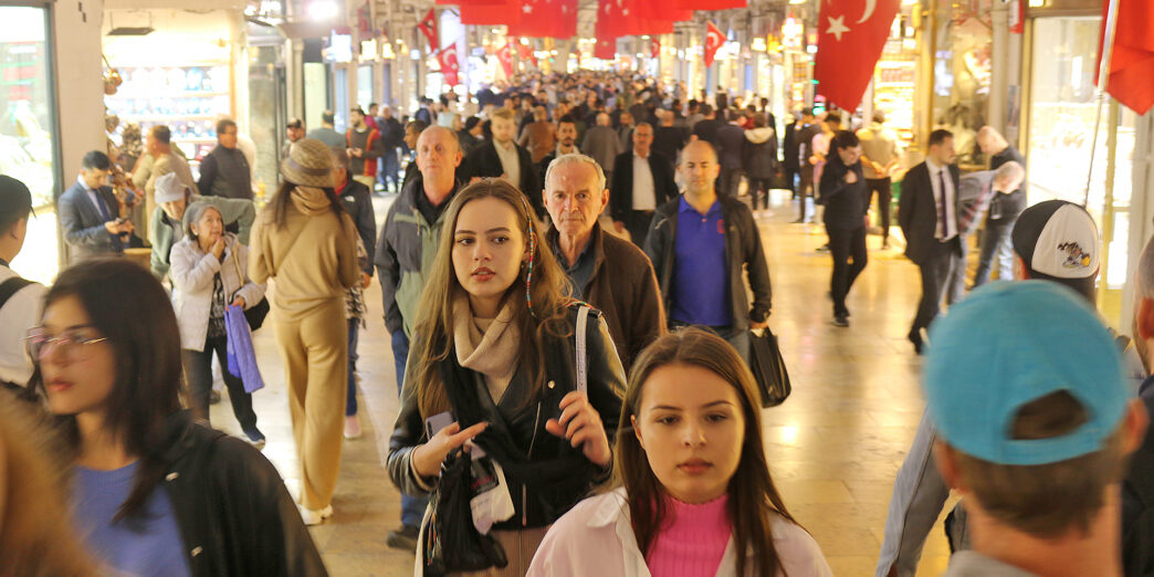 a group of people walking in a shopping mall