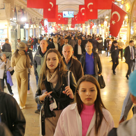 a group of people walking in a shopping mall