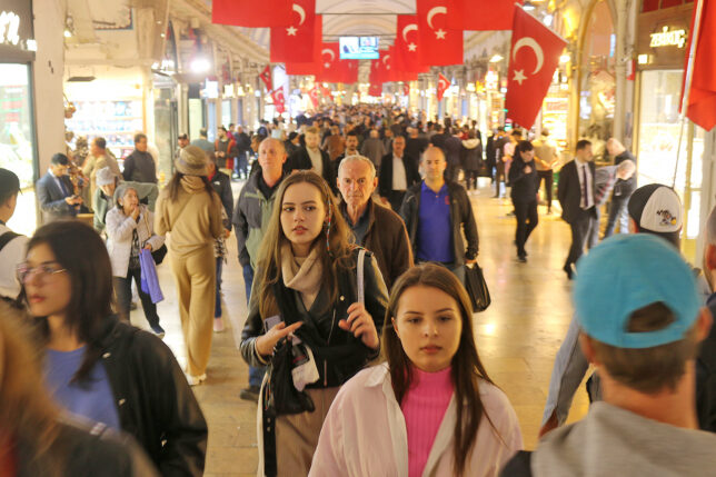 a group of people walking in a shopping mall