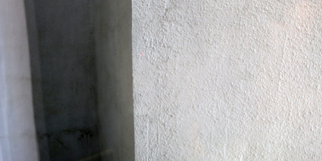 a white wall with a shadow