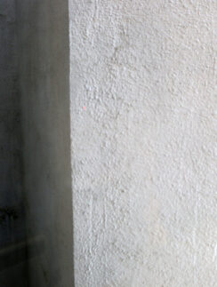 a white wall with a shadow