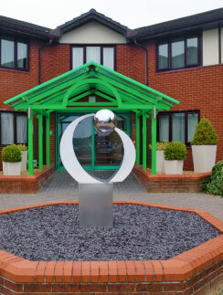 a sculpture in front of a building