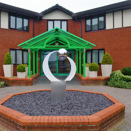 a sculpture in front of a building