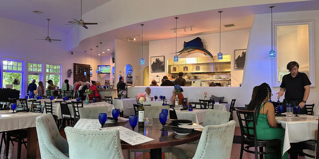 a room with a large table and chairs