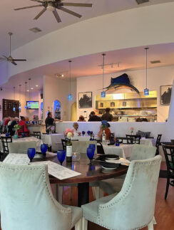 a room with a large table and chairs