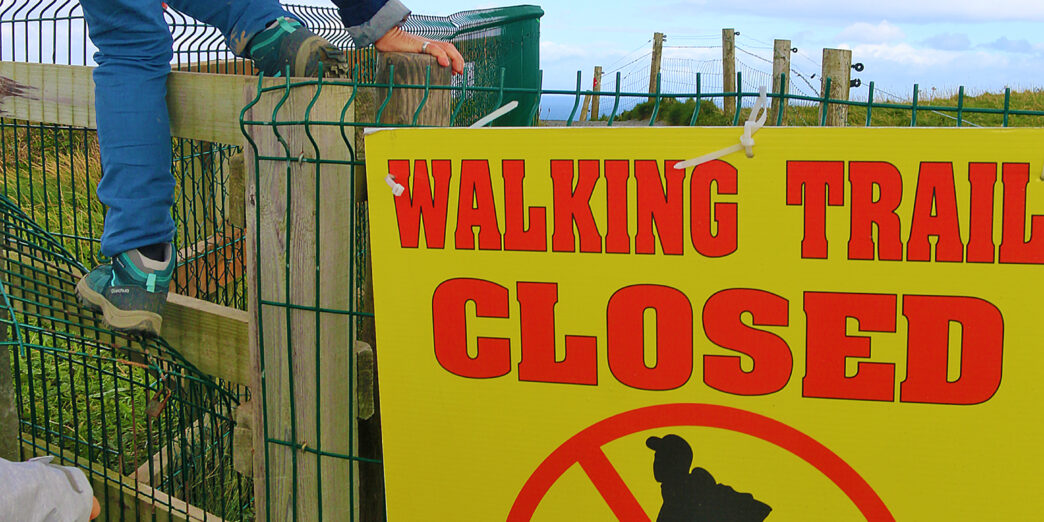 a person climbing a fence