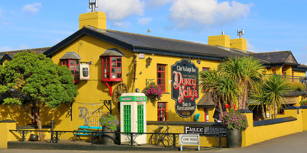 a yellow building with a sign on the front
